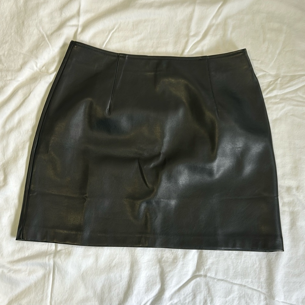 Black pleather miniskirt from with slight stretch